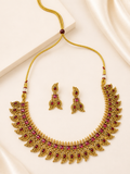 Antique gold-tone imitation temple necklace set with ruby-red acrylic stone inlays, leaf and paisley motifs, and matching drop earrings