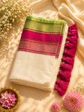 Off-white Mul Cotton saree with vibrant pink and green striped border and bright pink cotton tassels