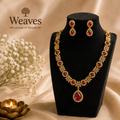 Ruby Red CZ Necklace and Earring Set in gold tone on black jewellery bust