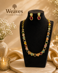 Multicolour Navratna CZ Necklace and Earring Set in gold tone on black jewellery bust