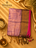 Purple soft tissue saree with a black and golden pallu, pink border, and tassel details