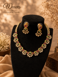 Ruby emerald floral necklace and matching earrings set with clear stone accents