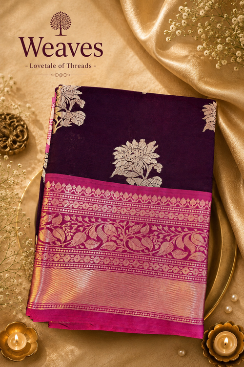 Deep purple Banarasi semi-silk saree with a pink border and gold-toned floral motifs