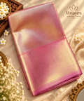 Folded dual-tone gold and pastel pink semi tissue silk saree with luminous sheen