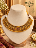 Gold-tone beaded choker necklace with engraved floral panels and deep pink stone accents