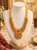 Gold-tone beaded temple-inspired necklace with floral medallion and cascading bead fringe