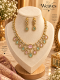 Gold-tone pastel pink and green teardrop necklace and matching earrings set with clear accents