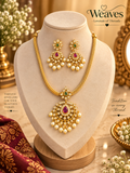 Gold-tone pink and green pendant necklace and matching earrings set with clear accents and pearl-like drops