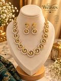 Gold-tone spiral necklace and matching earrings set with clear accent stones