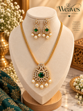 Emerald-green pearl drop necklace and matching earrings jewellery set on a display bust