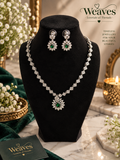 Silver-tone floral American diamond necklace set with purple pear-cut centre stone and matching earrings