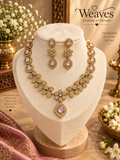 Victorian gold necklace set with blush pink stones, floral clusters, and matching long earrings