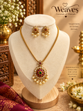 Antique gold chain necklace with red and green kemp stone temple pendant, pearl drops, and matching earrings
