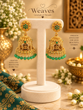 Antique gold Lakshmi temple jhumka earrings with green stone studs and green bead fringe