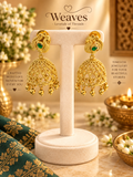 Gold filigree peacock jhumka earrings with green stone and gold ball drops