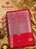 Red soft silk saree with silver-toned woven border and paisley detailing