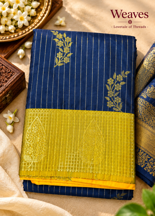 Blue and gold soft silk saree with mustard-gold border and floral motifs
