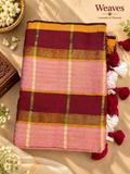 Mul cotton saree with burgundy body, pink checks, mustard-toned stripes, and tassels