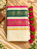 Pink, green and cream mul cotton saree with woven borders and colourful tassels